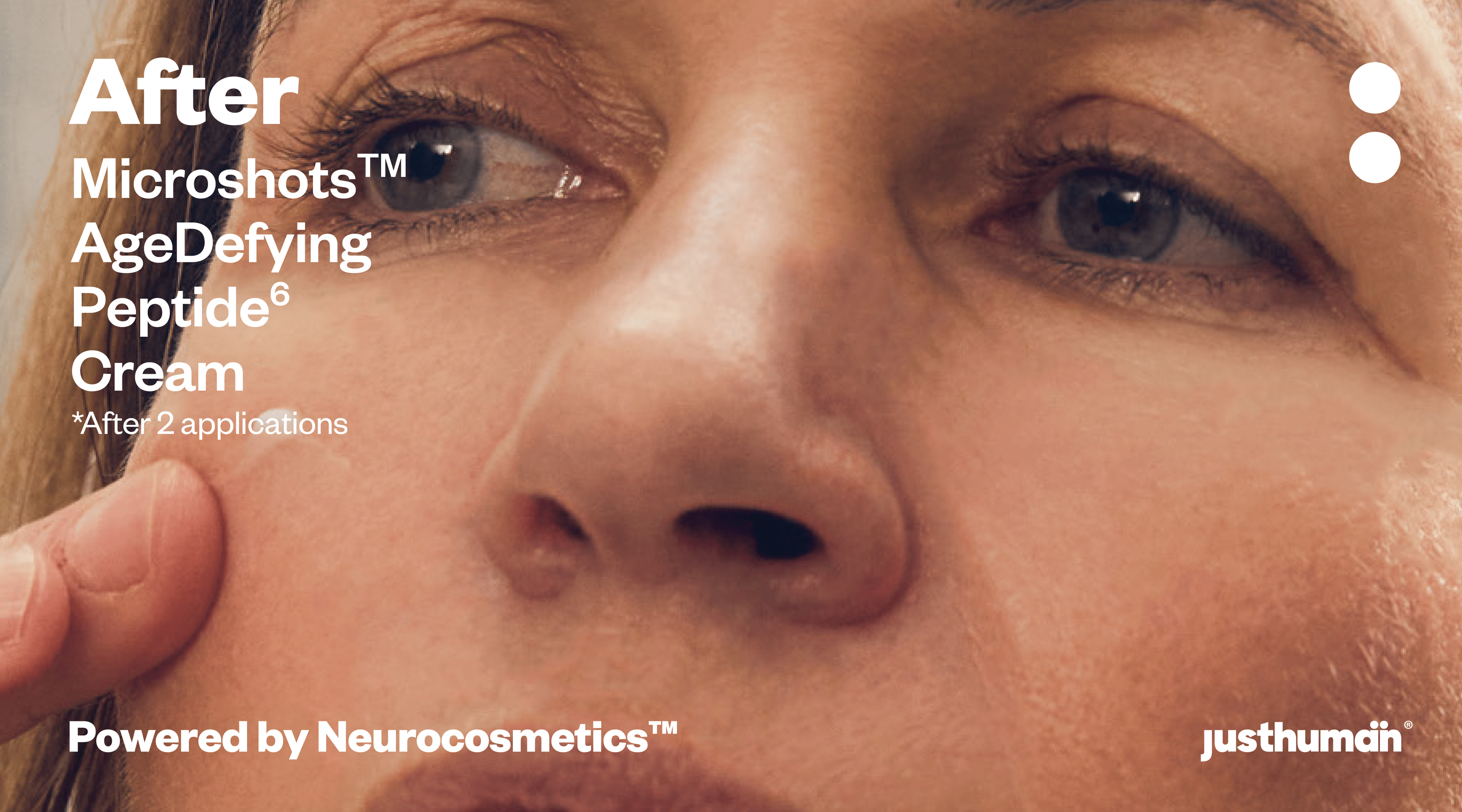 Close-up of a woman applying Justhuman's AgeDefying Peptide6 Cream